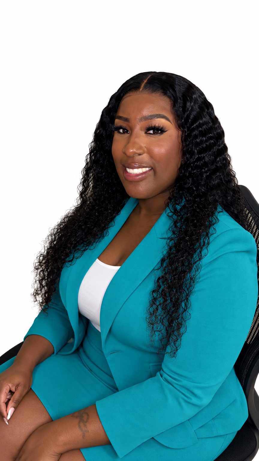 LaQuesha Washington, founder of LW Tax Services, in her turquoise suit